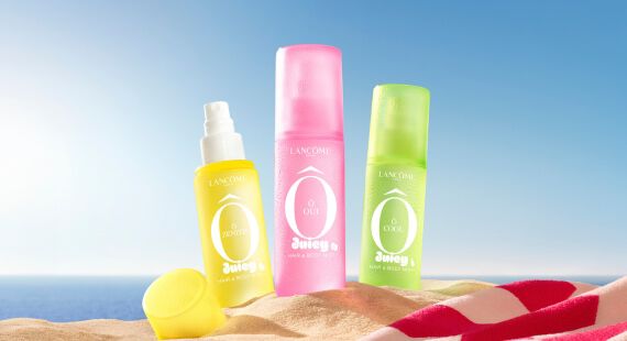 Zomerse Lancome banner met Summer Sets en de Les O-collectie, afgebeeld met een cute visual van een beker op het strand.
