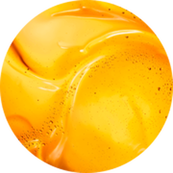 Abstracte close-up van glanzende gele verf met zachte contouren en luchtbelletjes.